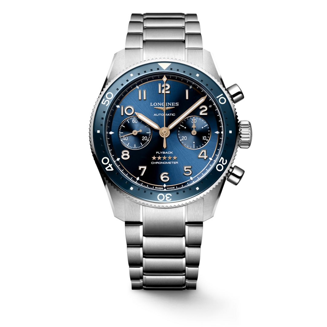 A Longines watch standing straight against a transparent background. The watch features a black & blue dial, white & gold hands and markers, a blue bezel, three crowns on the right side, and a stainless steel bracelet.