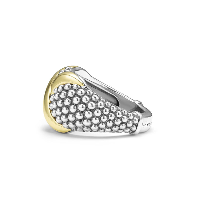 A side-view of a sterling silver and 18k gold ring displayed in the middle of a white background featuring smooth 18K gold and silver Caviar beading with an X motif.