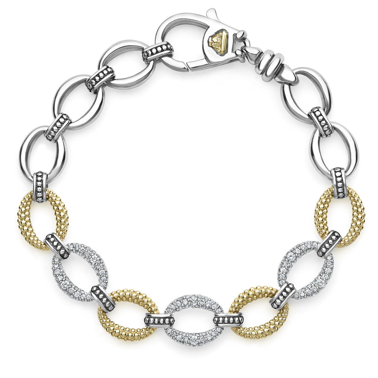 A Sterling Silver & 18k gold link bracelet resting in the middle of a white background. The bracelet has pave diamond links and a signature lobster clasp. 