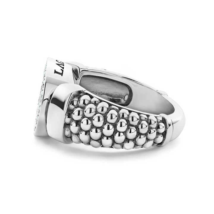 A side-view of a sterling silver ring in the middle of a white background featuring a diamond circle design and caviar beading.