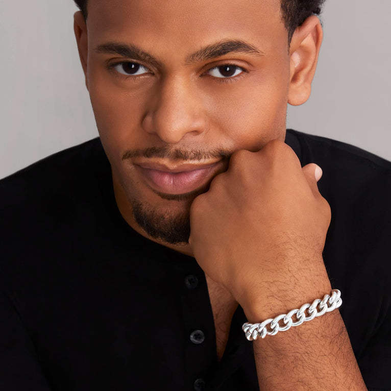 A man wearing a sterling silver & 18k gold chain featuring an 18k gold Krunch crescent