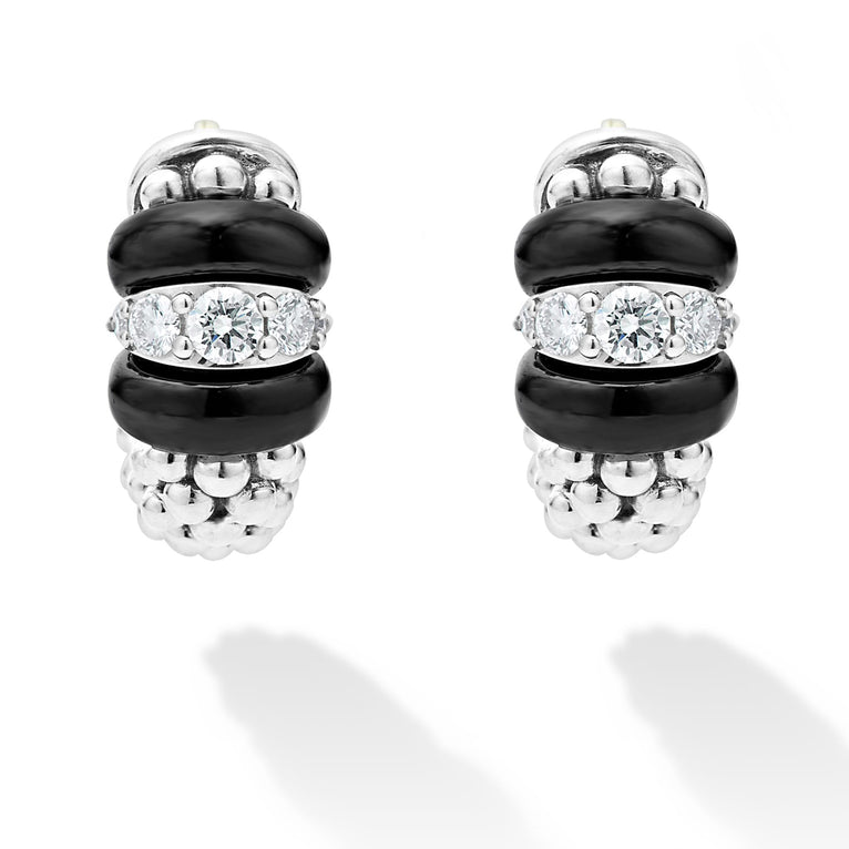 A pair of huggie earrings with smooth black ceramic and diamonds with Caviar beading.