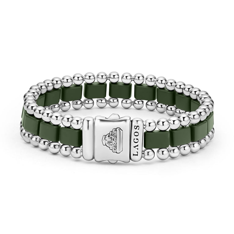 A back-view of a stainless steel bracelet in the middle of a white background featuring matte hunter-green ceramic and caviar beading.