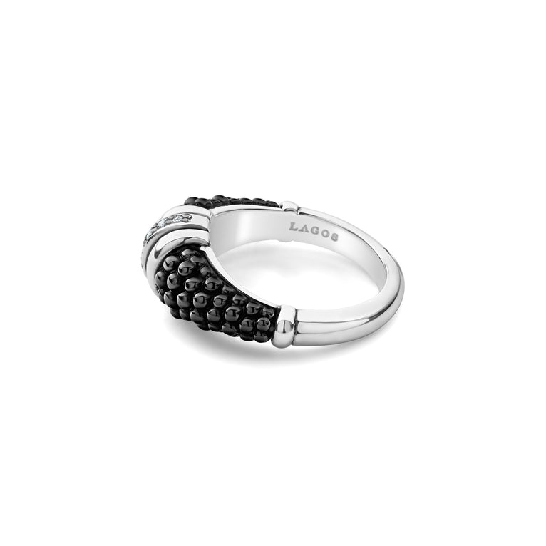 A side-view of a sterling silver ring is displayed on a white background featuring black ceramic caviar beading with a row of diamonds.