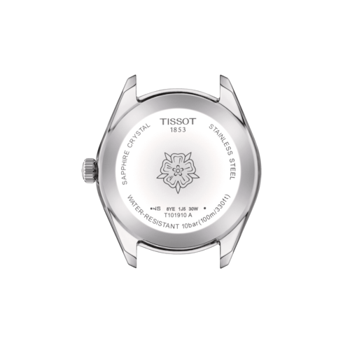 A close-up of the back of the Tissot dial against a transparent background. The dial has an engraved flower in the middle, and Tissot is engraved on the top.