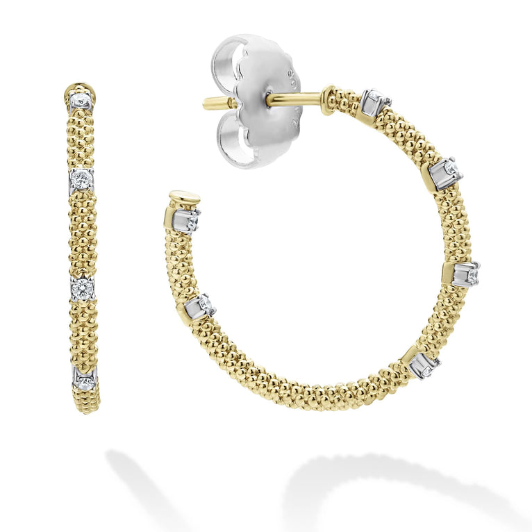 Hoop earrings with diamonds with 18k gold superfine Caviar beading. The right earring is angled, showing the back.