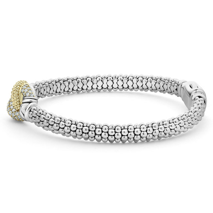 A side-view of a Sterling Silver and 18k gold bracelet is displayed on a white background. The bracelet features diamonds and gold women in a knot motif.