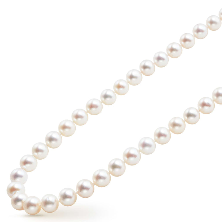 A close-up of a sterling silver &18k gold necklace angled to the right, featuring a strand of cultured freshwater pearls accented against a white background.