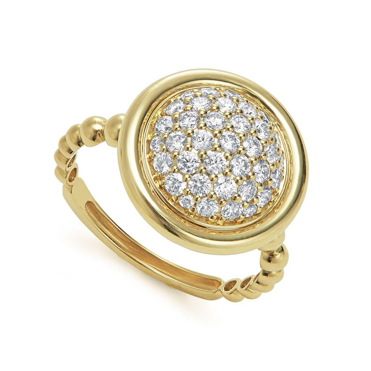 An 18K Gold round diamond ring angled to the right on a white background.