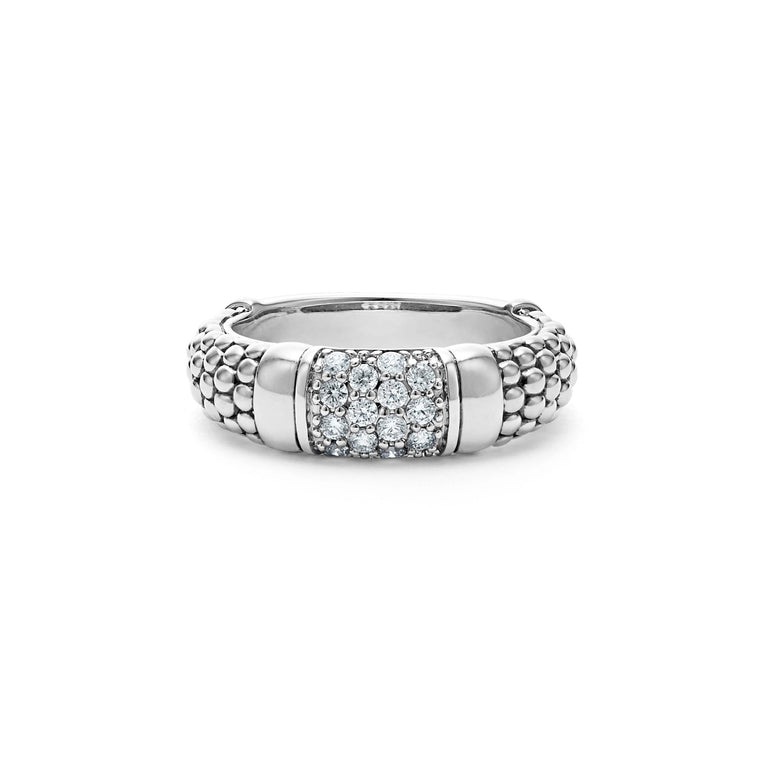 A sterling silver ring displayed in the middle of a white background featuring Pavé diamonds and silver Caviar beading