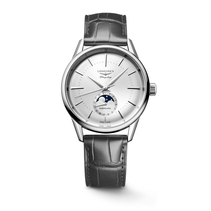 A Longines watch standing straight against a transparent background. The watch features a silver dial, silver hands and markers, a stainless steel bezel, a crown on the right side, and a black leather strap.