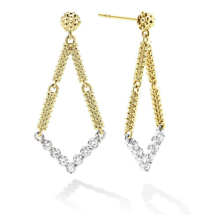 A pair of drop earrings with diamonds set in chevron-shaped motif and superfine caviar beading. The right earring is angled to the side.