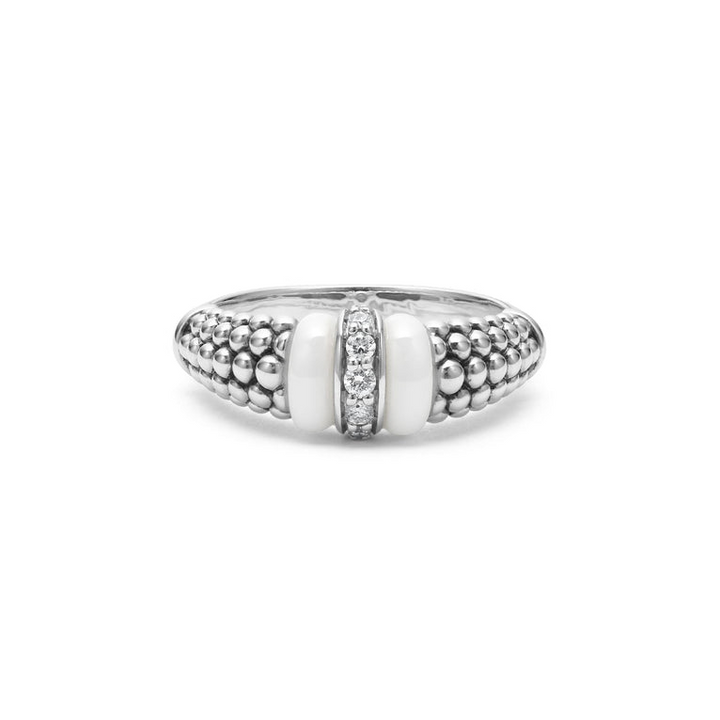 A sterling silver ring is displayed on a white background featuring white ceramic caviar beading with a row of diamonds.