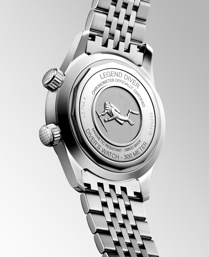 The back of a Longines watch is angled to the right, highlighting the case and bracelet details. 