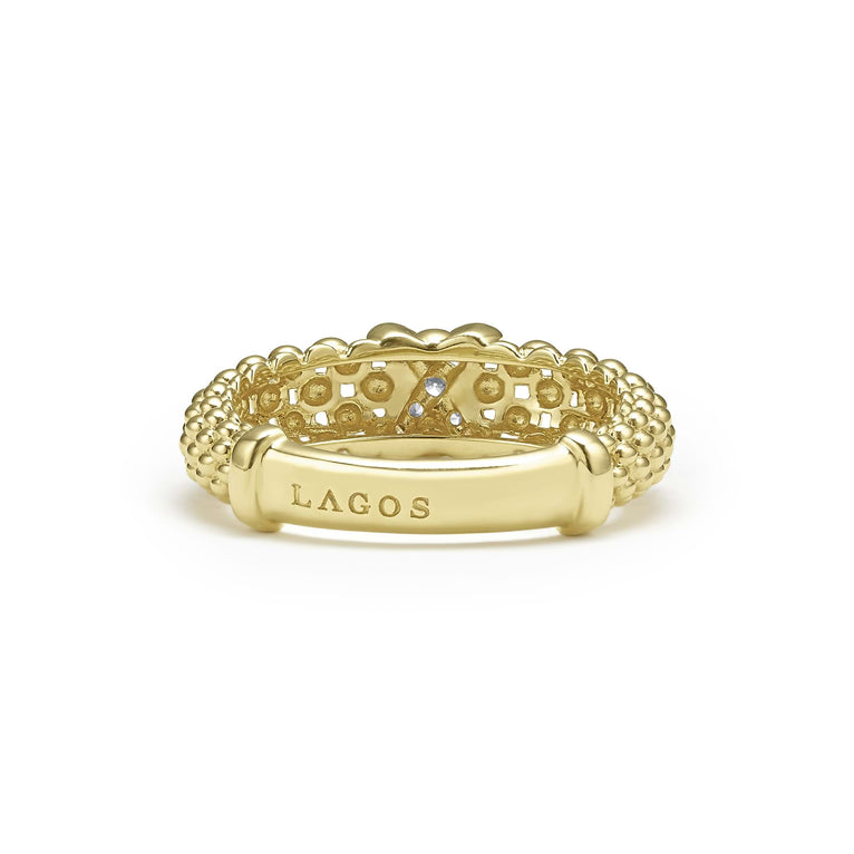 A back-view of a 18K gold diamond-set x-motif ring with caviar beading