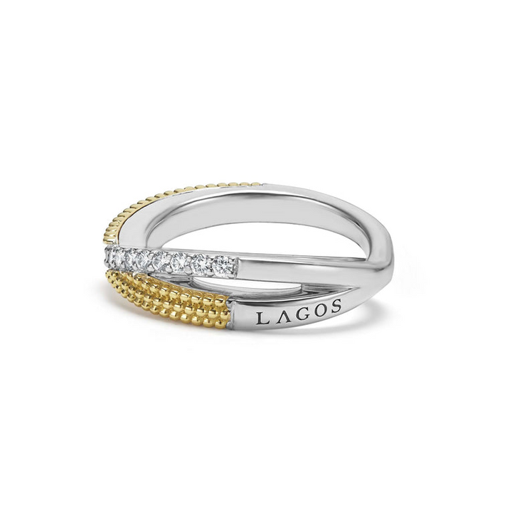 A side-view of a Sterling Silver & 18K Gold ring in the middle of a white background, featuring an x motif and caviar beading