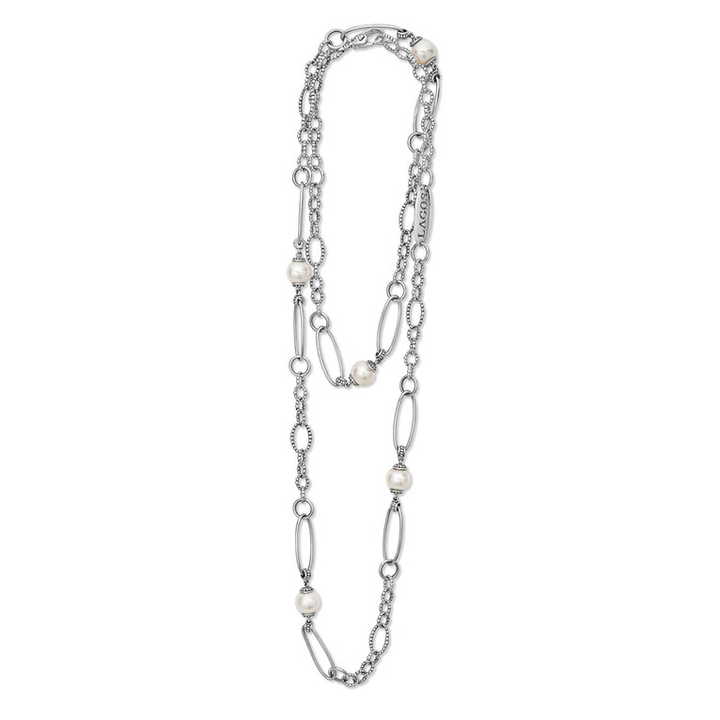 A sterling silver necklace featuring five cultured freshwater pearl stations and Caviar beading is displayed on a white background.