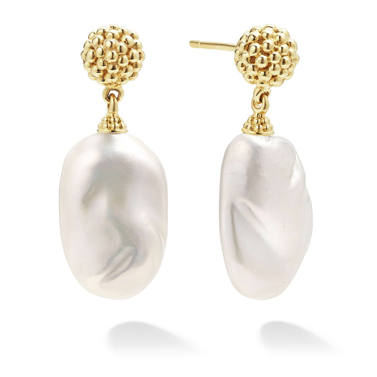 Drop earrings with an 18K gold Caviar beading frame and cultured freshwater pearl baroque. The right earring is angled.