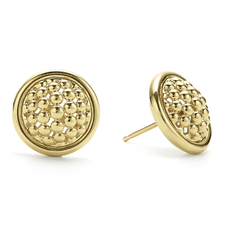 18k gold Caviar beading surrounded by gold ceramic detailing form on the studs earrings. The stud on the right is angled.