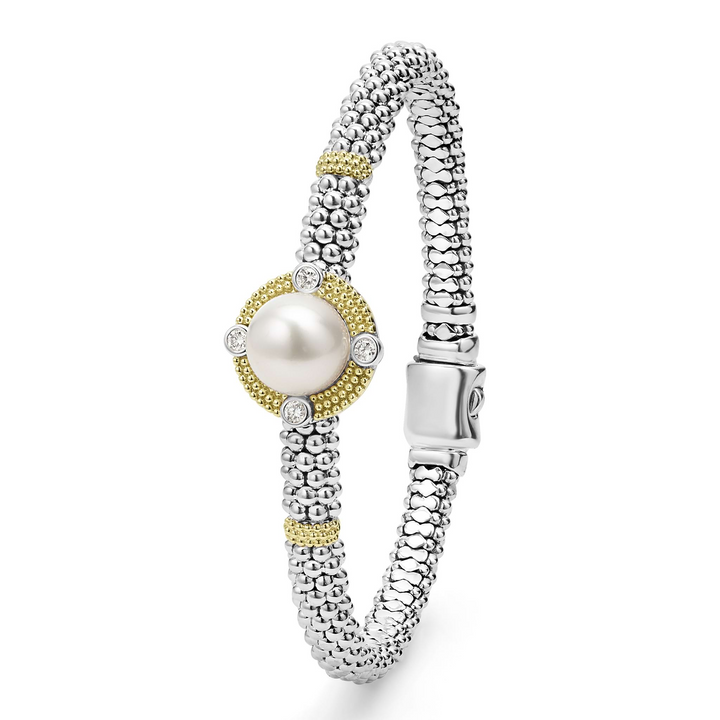 A sterling silver & 18k gold bracelet standing vertically in the middle of a white background featuring a freshwater cultured pearl surrounded by diamonds, smooth sterling silver, Caviar beading, and 18K gold stations.