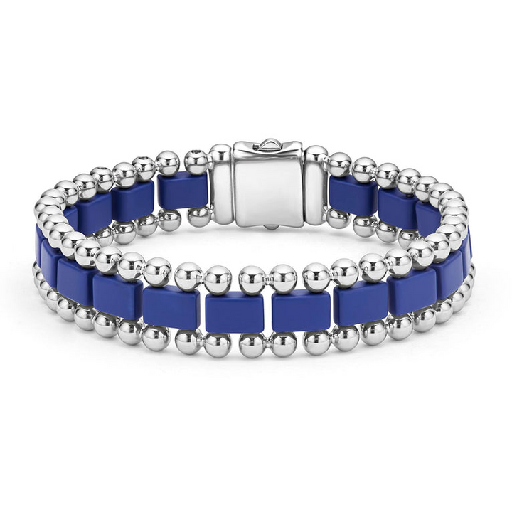 A stainless steel bracelet in the middle of a white background featuring matte ultramarine ceramic and caviar beading.