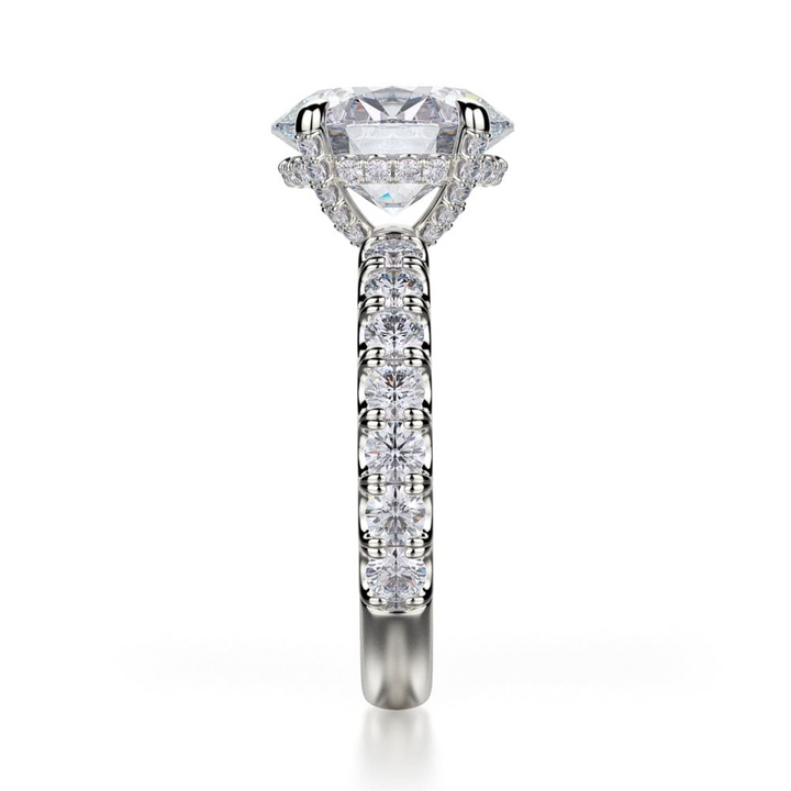 A side-view of the 3/4 Eternity Engagement Ring, made of white gold. The side view shows the diamond's pavilion and round diamond set band.