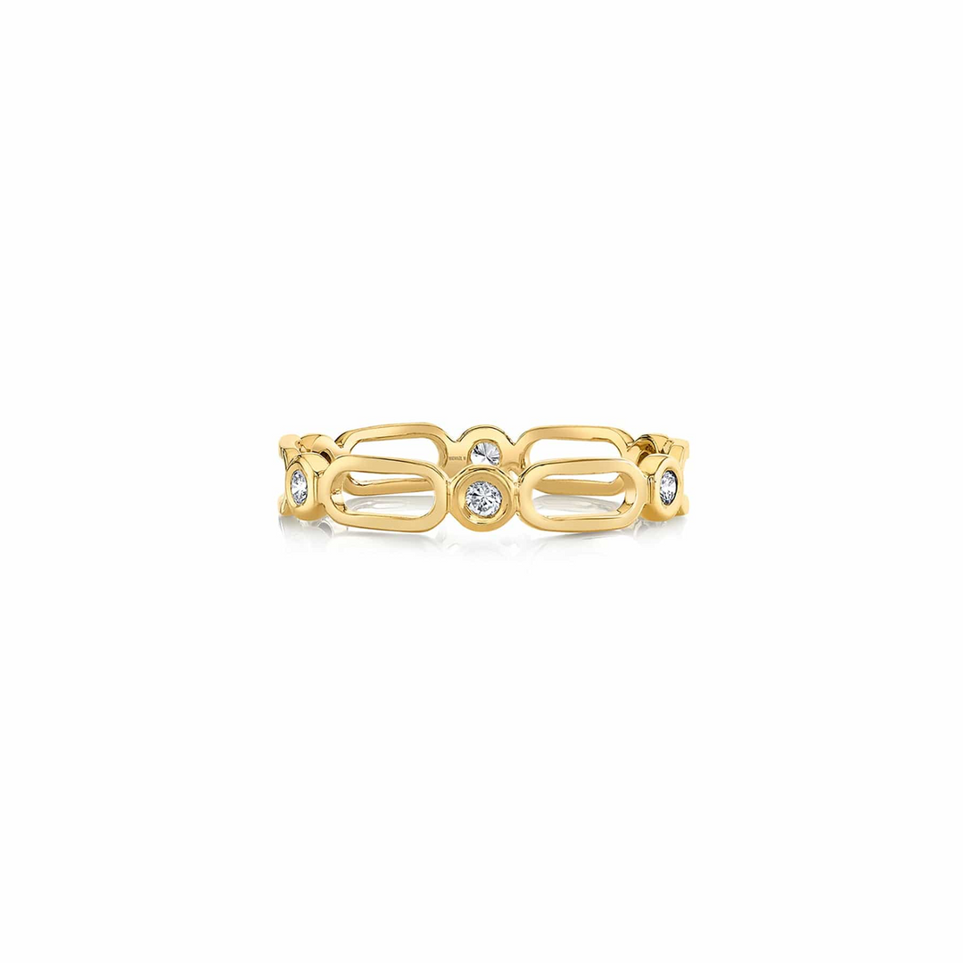 A yellow-gold bracelet lying flat across a white background. The ring features alternating links and diamond-set bezel pattern stacks.