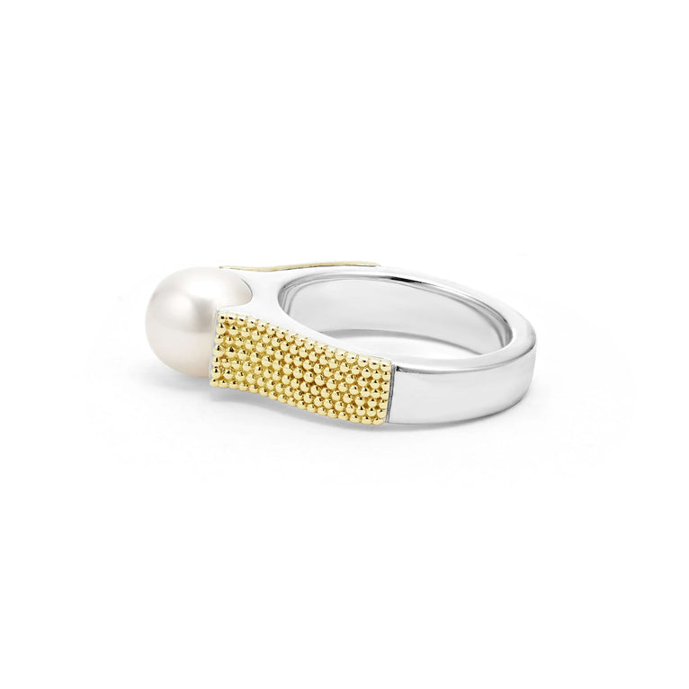 A back-view of a sterling silver and 18k gold ring displayed in the middle of a white background featuring a cultured freshwater pearl and caviar beading. 