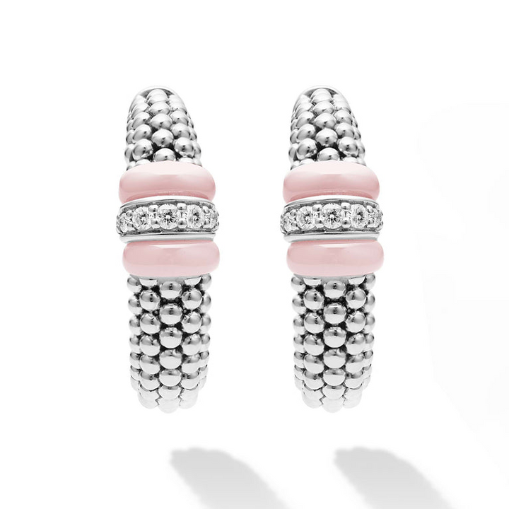 A pair of hoop earrings with pink ceramic and a diamond station with sterling silver Caviar beads. The right earring is angled to the side, showing the back.