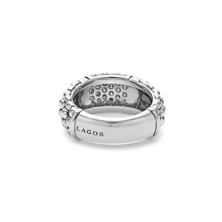 A back view of a Sterling Silver ring featuring smooth sterling silver stations, caviar beading, and diamond-set stations.