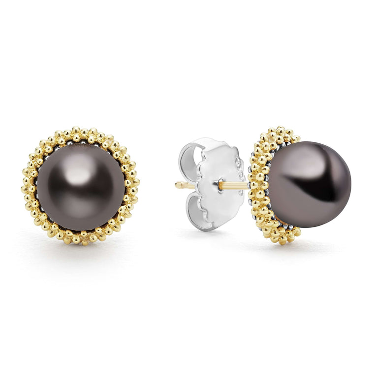 Tahitian black pearl stud earrings set in 18K gold Caviar beading. The right earring is angled, showing the back.