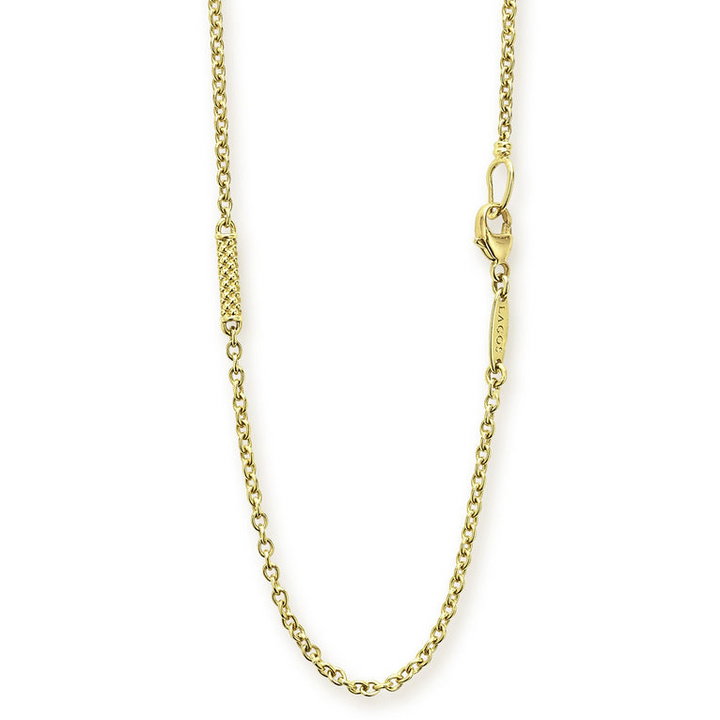 A close-up of an 18k gold necklace highlighting the clasp.