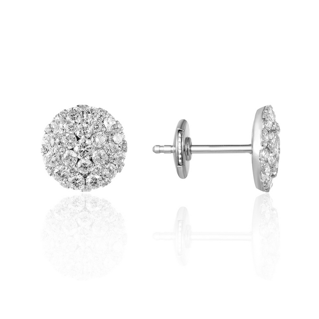 A pair of stud earrings with a round diamond shape with a cluster of diamonds. The right earring is angled to the side, showing the back.