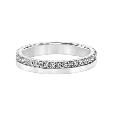 A white gold ring lies flat against a white background. It features a split band with a row of pave diamonds.