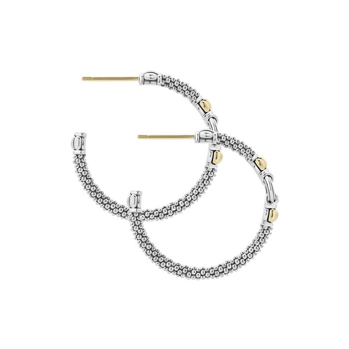 A pair of hoop earrings made from Sterling silver Caviar, with a circle motif and 18K gold accents. Both earrings are angled to the side.