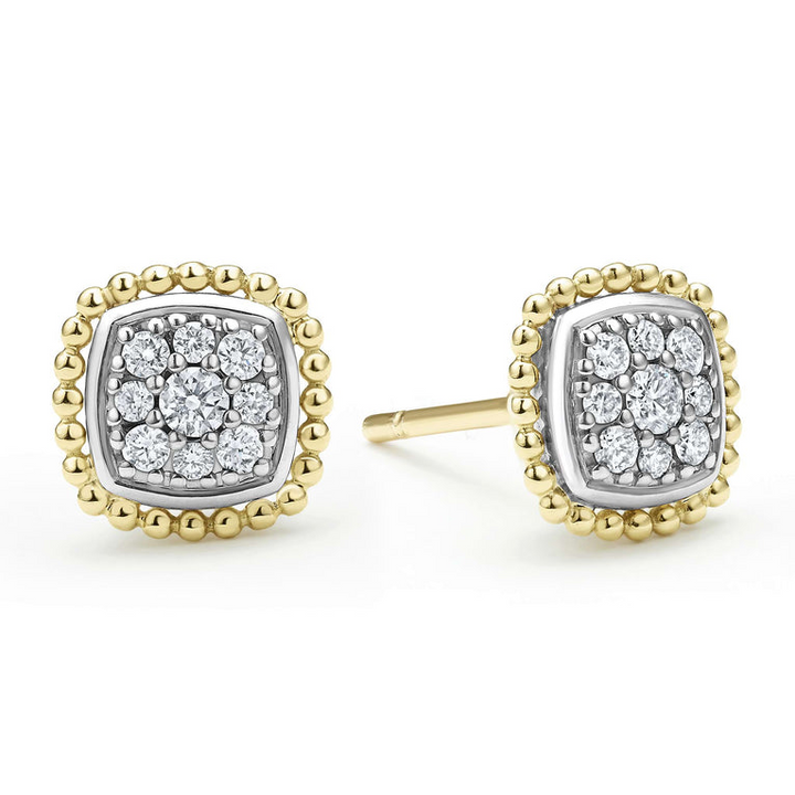 A pair of two-toned stud earrings surrounded by 18K gold Caviar beading and smooth sterling silver. The right earring is angled to the side. 