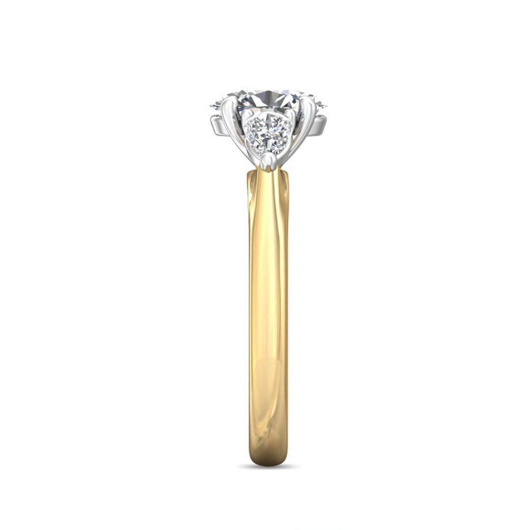 A side-view of the Pear Side Stones Engagement Ring, made of yellow gold. The side view shows the diamond's pavilion and the side of the gold band with diamonds.