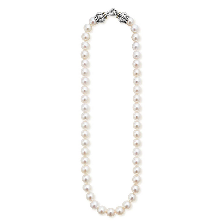 A sterling silver &18k gold necklace featuring a strand of cultured freshwater pearls accented against a white background and showing the clasp at the top against a white background.