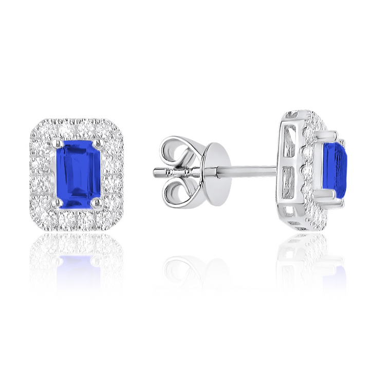 A pair of stud earrings, a sapphire emerald-shaped diamond in the middle, and a surrounding diamond frame. The right earring is angled to the side, showing the back.