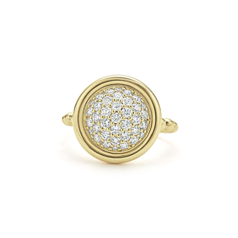 An 18K Gold round diamond laid flat against a white background.