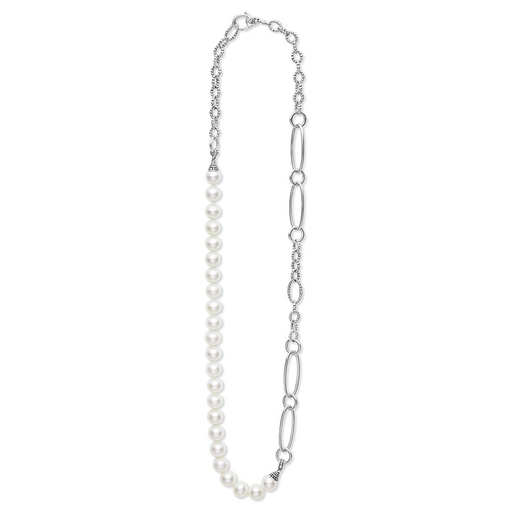 A sterling silver necklace featuring cultured freshwater pearl stations is highlighted with Caviar beading and shows the clasp at the top.