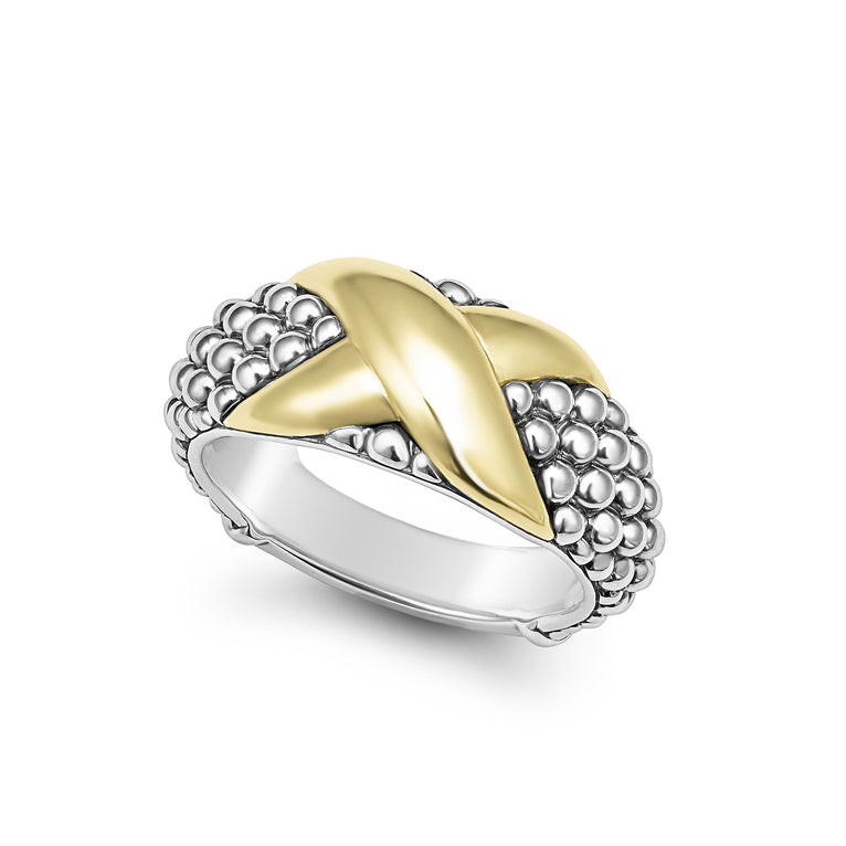 A Sterling Silver & 18K Gold ring in the middle of a white background, featuring an x motif and caviar beading