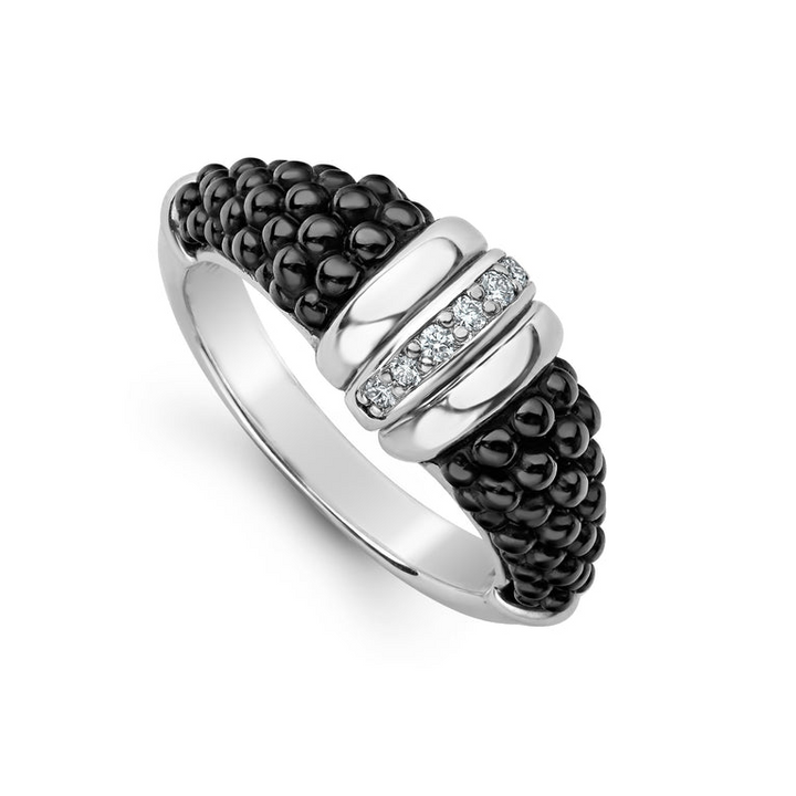 A sterling silver ring is displayed angled on a white background featuring black ceramic caviar beading with a row of diamonds.