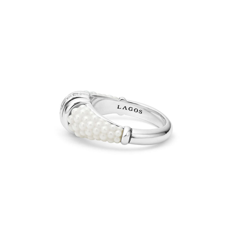 A side-view of a sterling silver ring is displayed on a white background featuring white ceramic caviar beading with a row of diamonds.