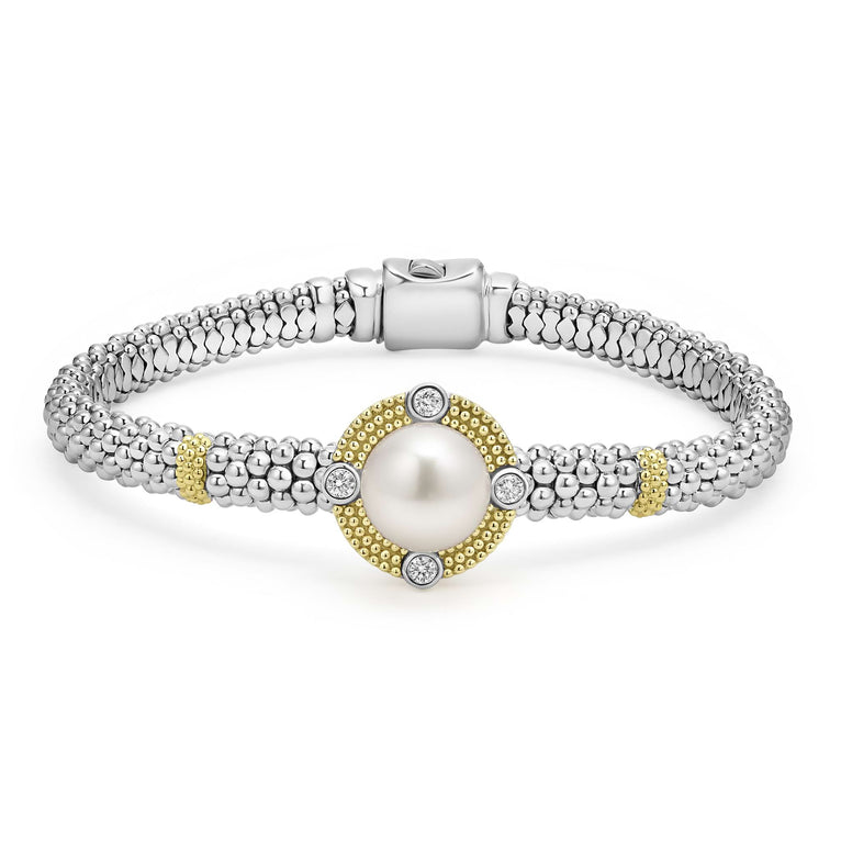 A sterling silver & 18k gold bracelet displayed in the middle of a white background featuring a freshwater cultured pearl surrounded by diamonds, smooth sterling silver, Caviar beading, and 18K gold stations.