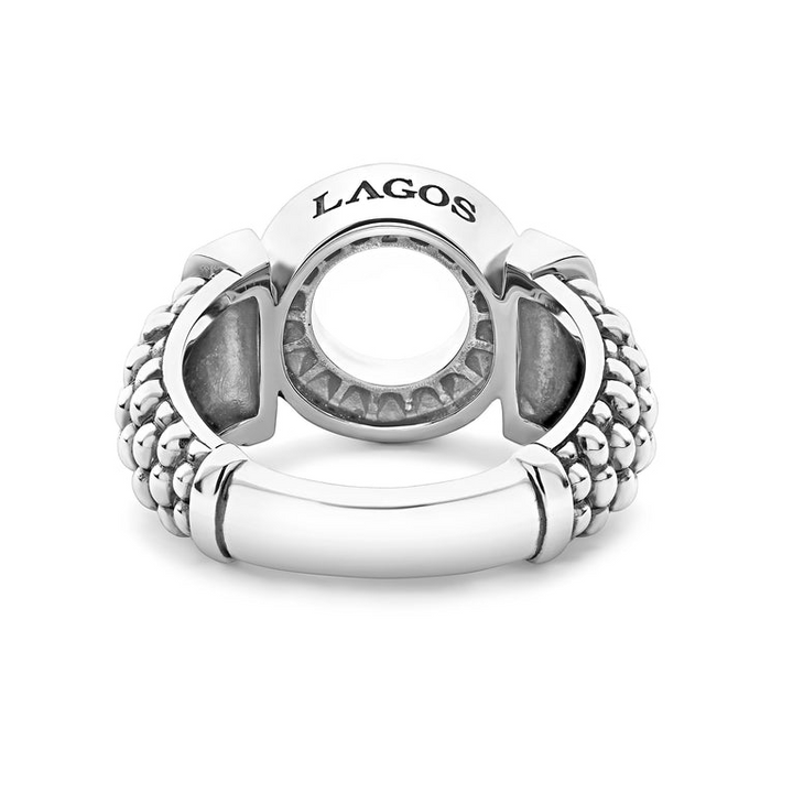 A back-view of a sterling silver ring in the middle of a white background featuring a diamond circle design and caviar beading.