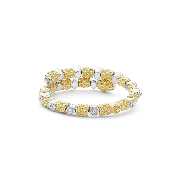 A back-view of An 18K Gold ring in the middle of a white background featuring diamonds surrounded by 18k gold superfine Caviar beading in a wrap design.