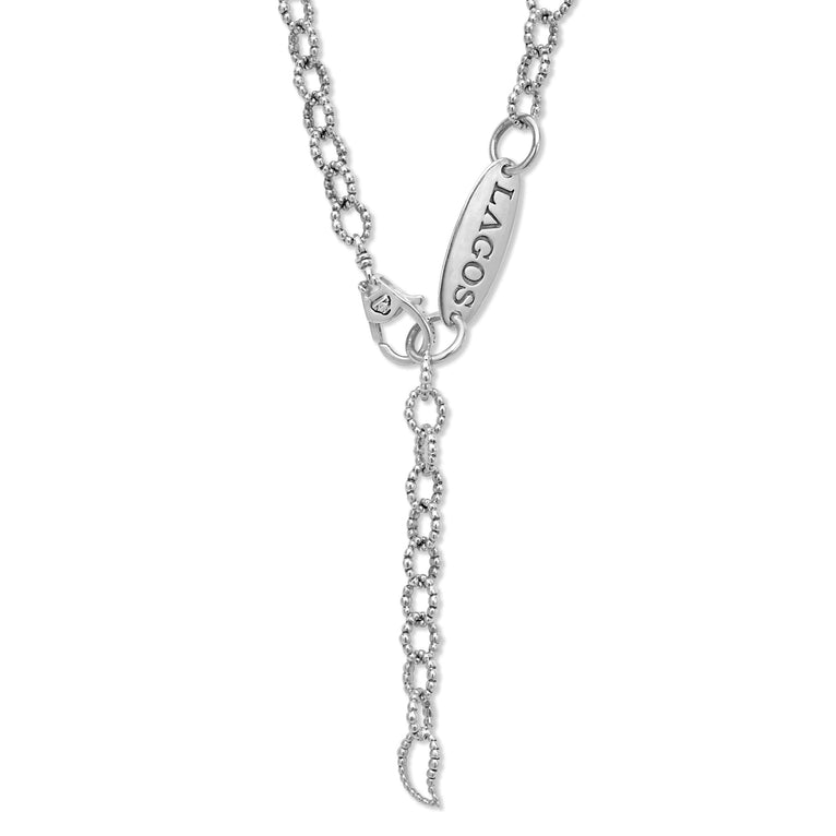 A sterling silver necklace featuring five cultured freshwater pearl stations and Caviar beading displayed on a white background, focusing on the clasp.