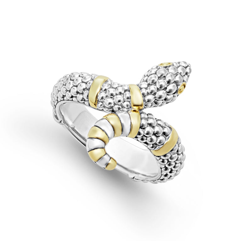 A sterling silver ring is displayed angled on a white background featuring a snake motif with Sterling silver Caviar beading highlighted by 18K gold stations