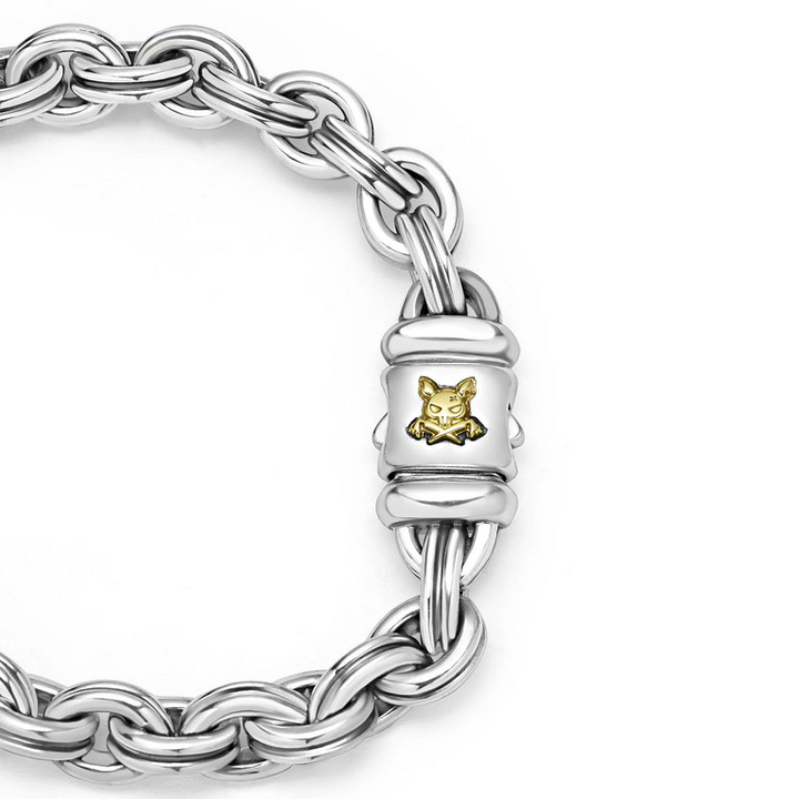 A sterling silver bracelet in the middle of a white background featuring double link chain and krunch crescent on the clasp